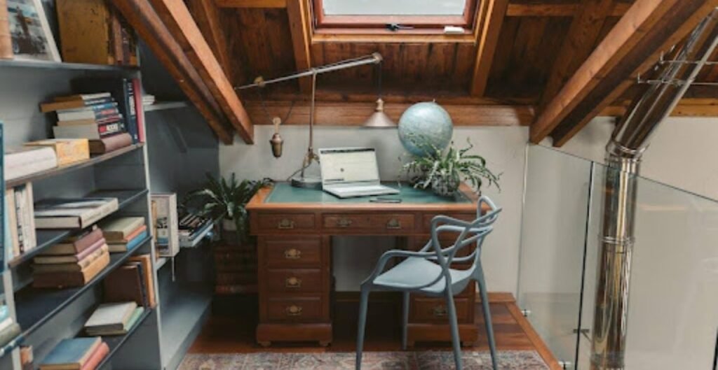  Silver laptop on a brown wooden desk